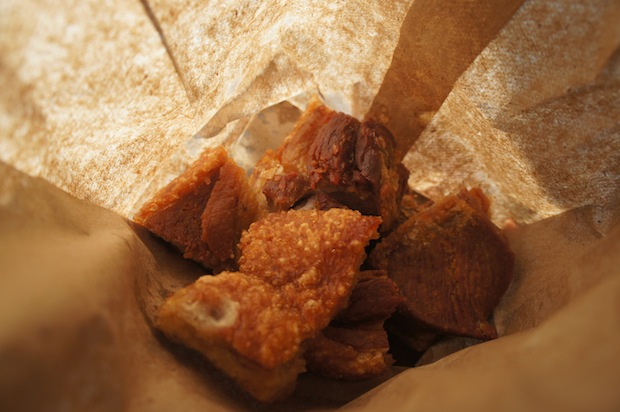 Chicharrones - fried pork skin - in a paper bag from El Palacio de los Jugos. Super cheap street food.