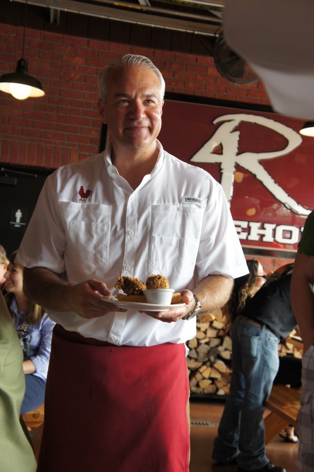 Chef John Rivers presenting the Coop's Chicken and Waffles