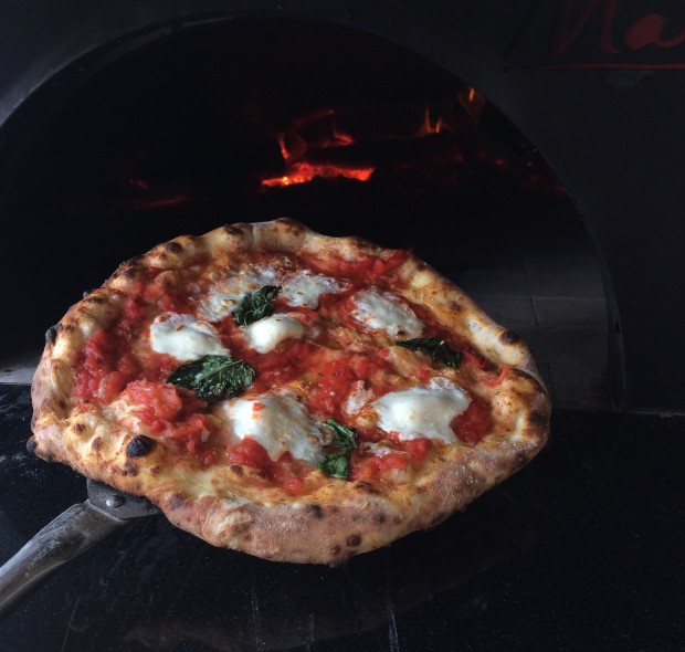 The Margherita Pizza - classic fresh mozzarella, red sauce and fresh basil. 