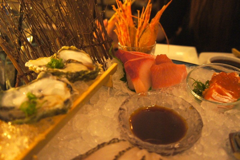 Sashimi platter at Umi with slices of tuna, snapper, oyster, and more