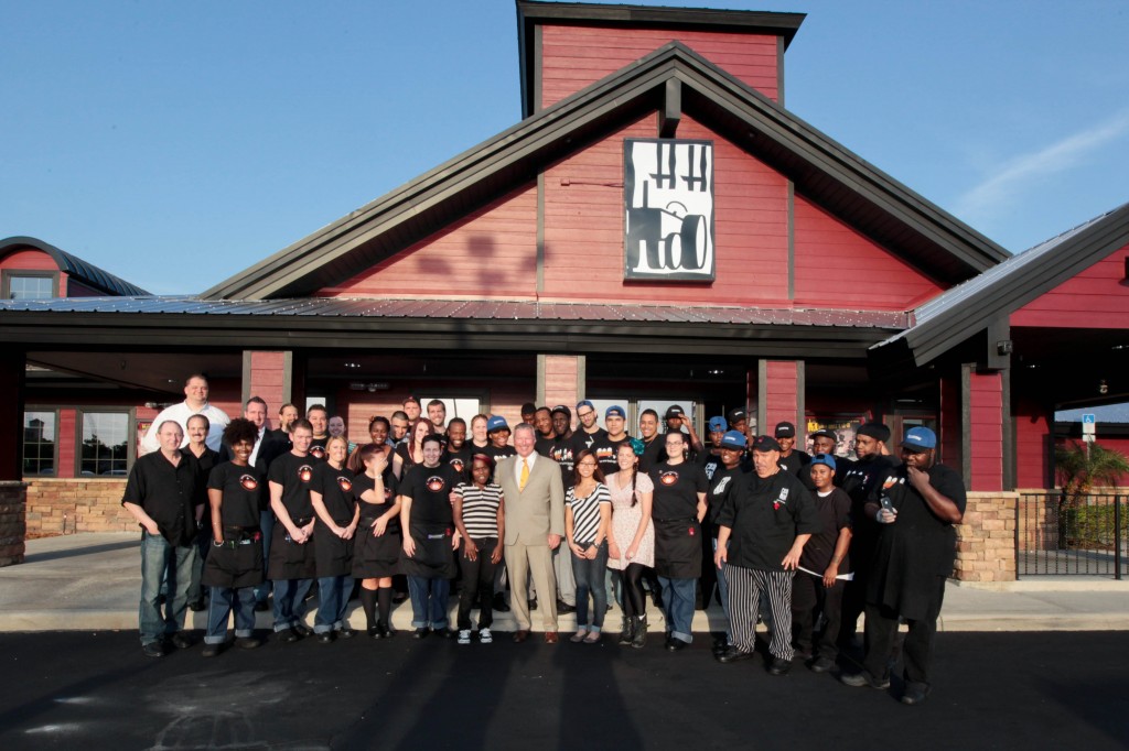 Mayor Buddy Dyer and Commissioner Samuel B. Ings with the staff at Hash House A Go Go