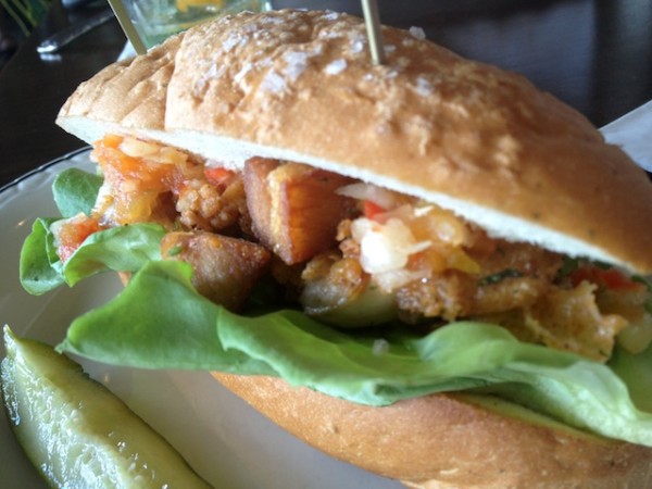 Po' Boy sandwich ($13) celery seed hoagie from Old Hearth Bakery, crispy and soft oysters and bacon (fried pork belly chunks), green tomato chow-chow