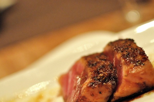 Seared Tuna - red wine reduction served with wilted kale and vegetable cous cous