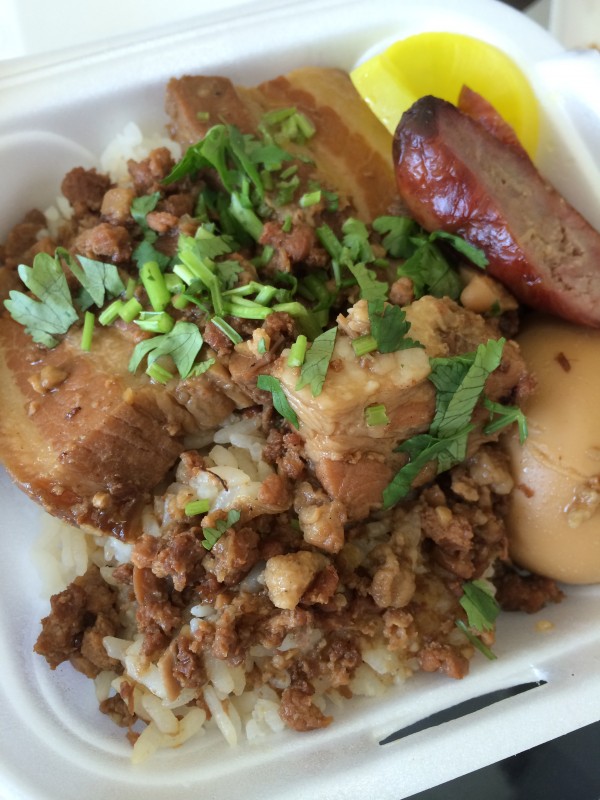 Simmered pork belly over rice with Taiwanese sausage and hard boiled egg - I think simmered means braised...