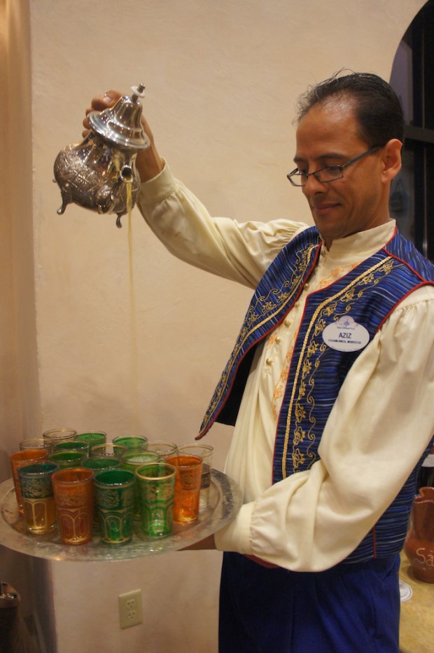 "Higher, Higher!" the staff shout as the waiter pours the tea from his pot