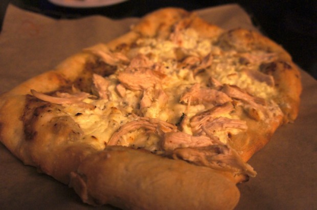 Bistro Rustic "Hearth Bread" pizza - 4 local farms cheese, pulled chicken,   garden herbs and olive oil  