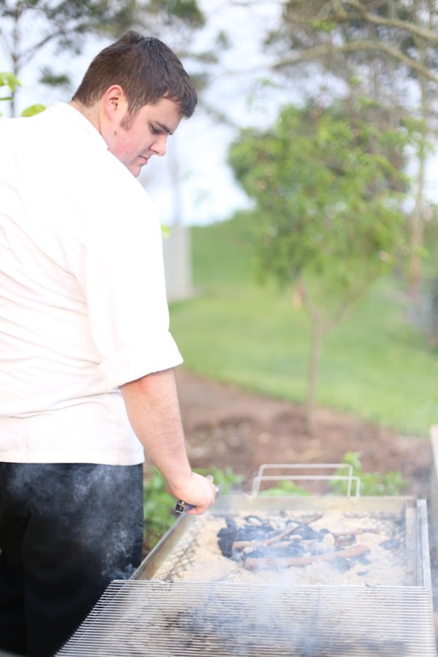 Grilling the oysters and clams on La Caja China