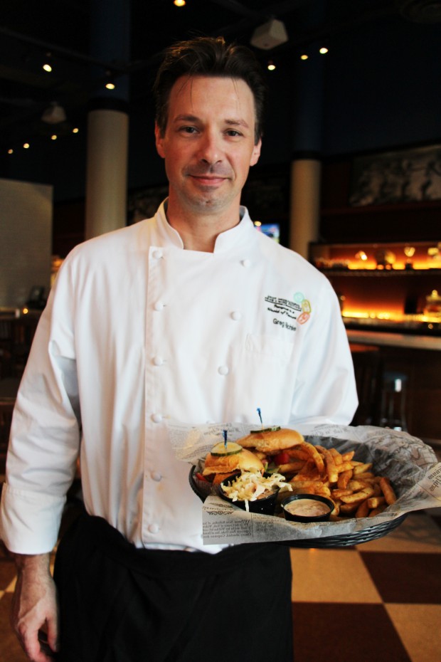 CityFish Executive Chef Greg Richie with the Cornmeal Crisped Shrimp Po Boy - Photo by Unique Michael