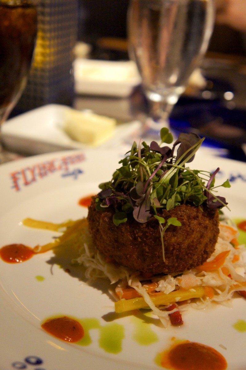 Crispy Maine Coast Jonah Crab Cake - Savory Vegetable Slaw, Roasted Red Pepper Coulis, and Ancho Chile Rémoulade - $17.00 